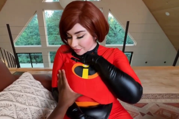 A busty doll in a red dress and black boots